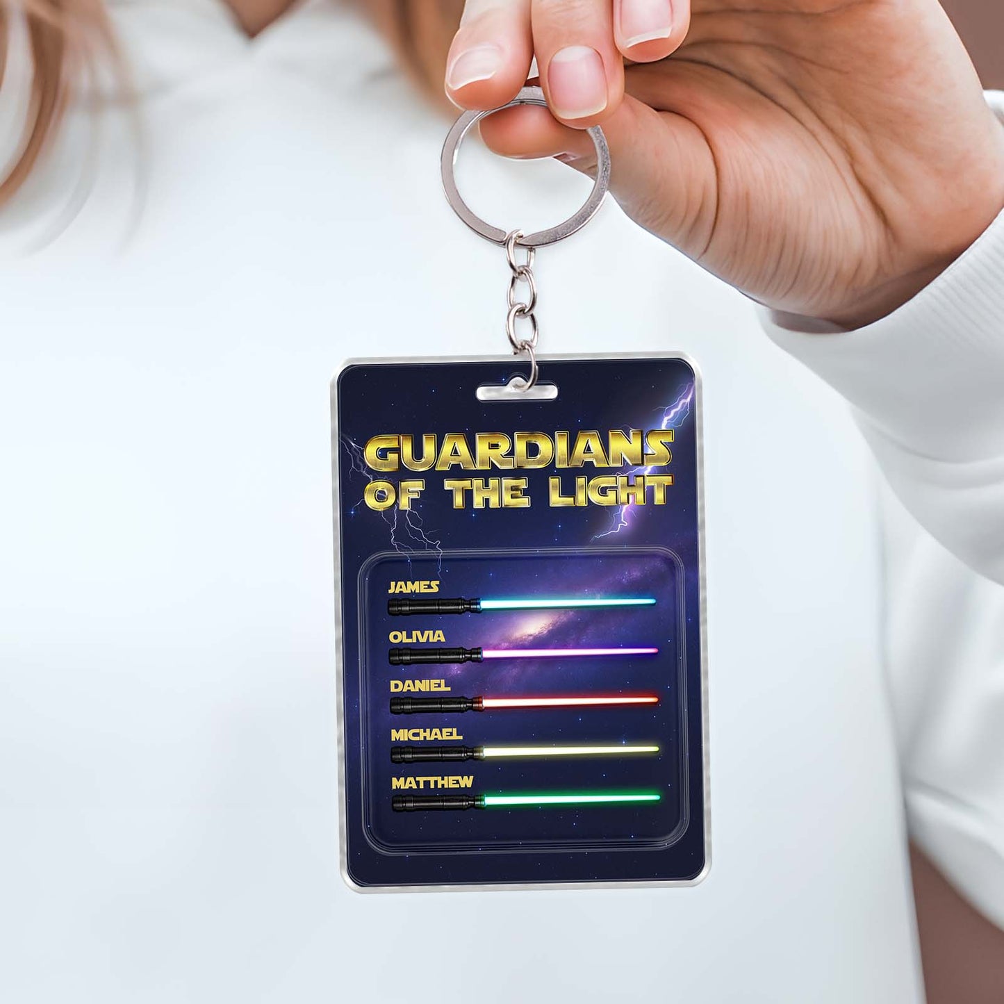 Personalized father keychain featuring custom names with a cosmic background design