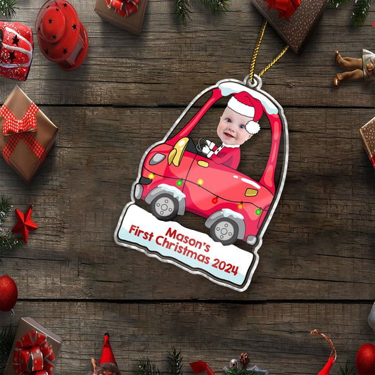 Personalized first Christmas ornament featuring a baby in a red car with Santa hat and custom text