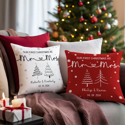 Personalized first Christmas pillow set with Mr and Mrs design in white and red on couch near Christmas tree