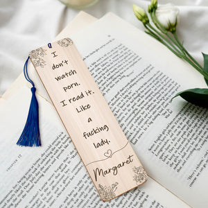 Personalized funny bookmark for women with a humorous quote and floral design on a wooden surface