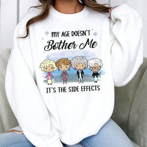 White sweatshirt with a design saying My Age Doesn't Bother Me It's the Side Effects, personalized funny shirt