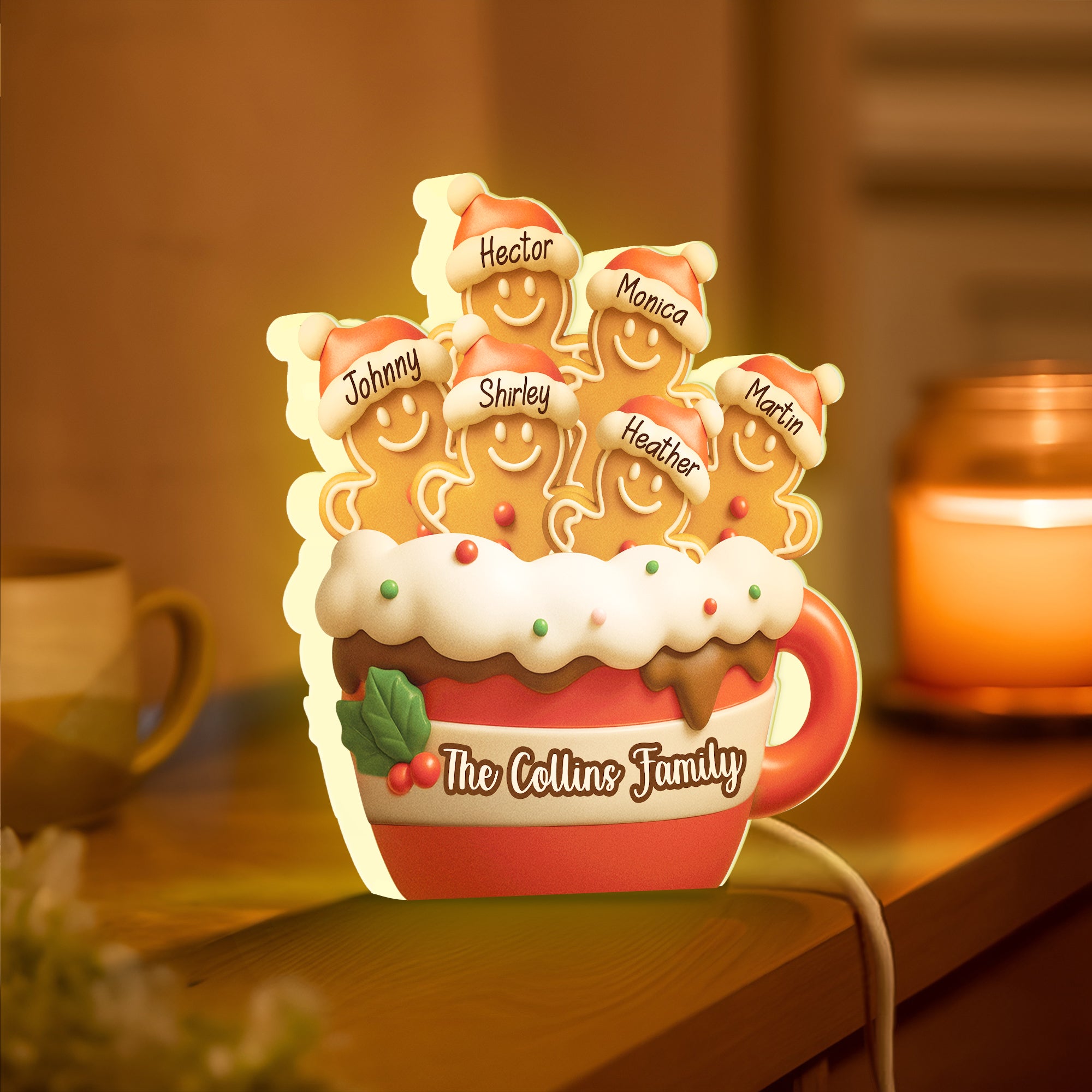 Personalized gingerbread Christmas light box featuring smiling gingerbread men and family names