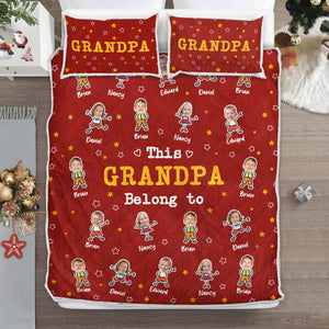 Personalized grandma and grandpa quilt featuring names and playful designs on a red background