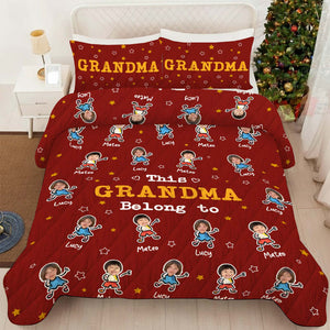 Personalized grandma and grandpa quilt with colorful characters and names on a cozy red background