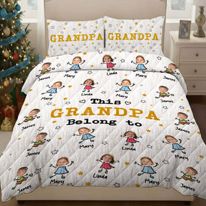 Personalized grandma and grandpa quilt featuring family photos and names on a cozy design