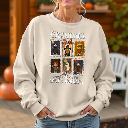Personalized grandma halloween shirt with cartoon horror characters and custom names on a beige sweatshirt