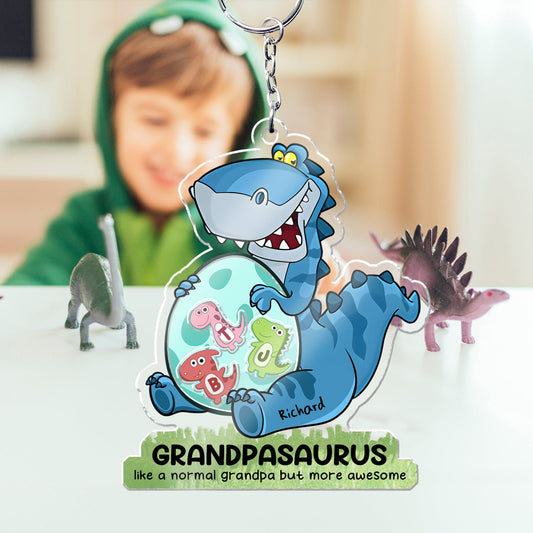 Personalized grandpa keychain with a cartoon dinosaur design that says Grandpasaurus