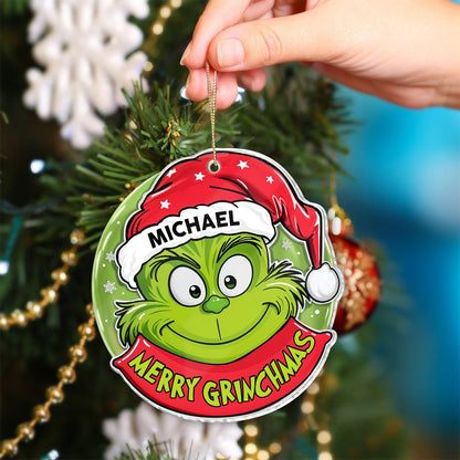 Personalized Grinch Christmas ornament with red Santa hat and name Michael hanging on Christmas tree