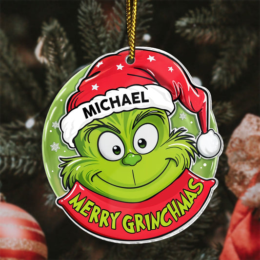 Personalized Grinch Christmas ornament with green Grinch wearing a red Santa hat and Merry Grinchmas text