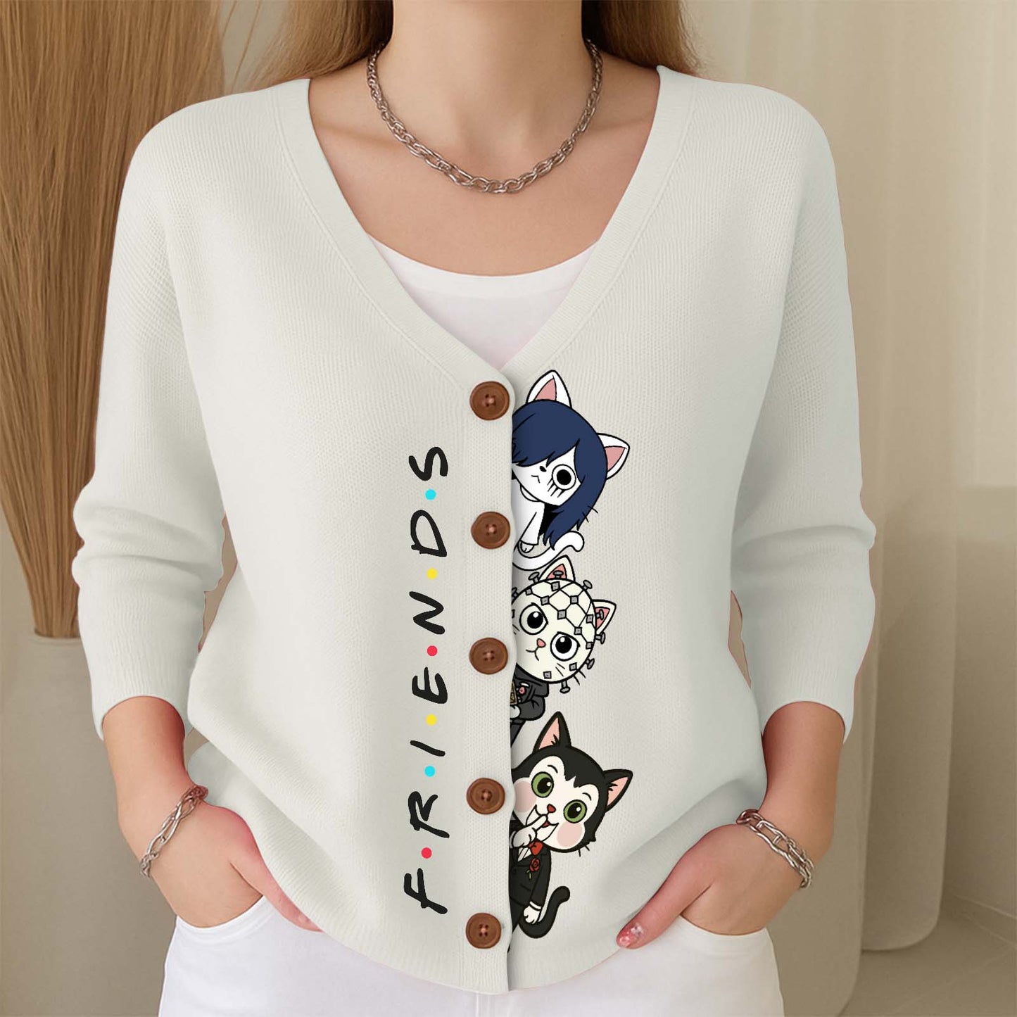 White personalized Halloween cat cardigan featuring playful cat designs and button details