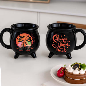Personalized Halloween cauldron mug featuring witches and a full moon design with custom names