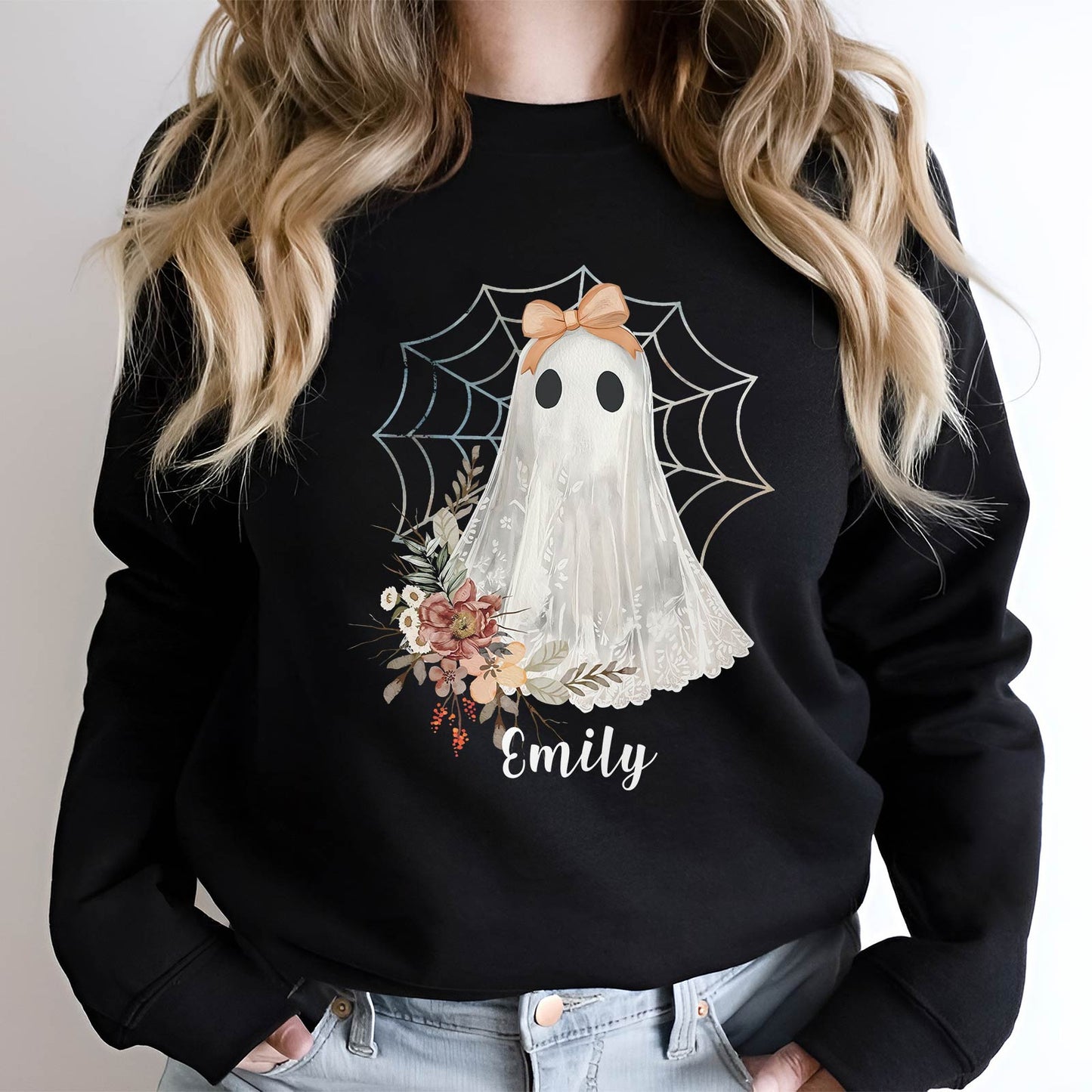 Black personalized Halloween ghost shirt with floral design and spider web featuring the name Emily