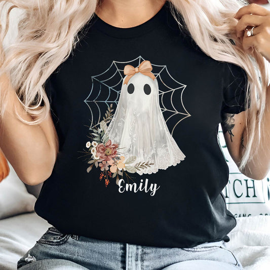 Black personalized Halloween ghost shirt with a cute ghost, floral design, spiderweb, and name Emily