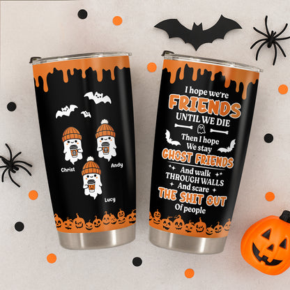 Personalized Halloween tumbler with spooky ghost friends design and Halloween-themed orange and black decor