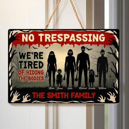 Halloween Wooden Door Sign featuring No Trespassing text silhouetted spooky family and graveyard scene