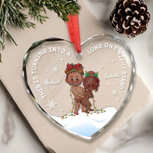 Personalized heart glass ornament featuring a festive couple with playful text for holiday decoration