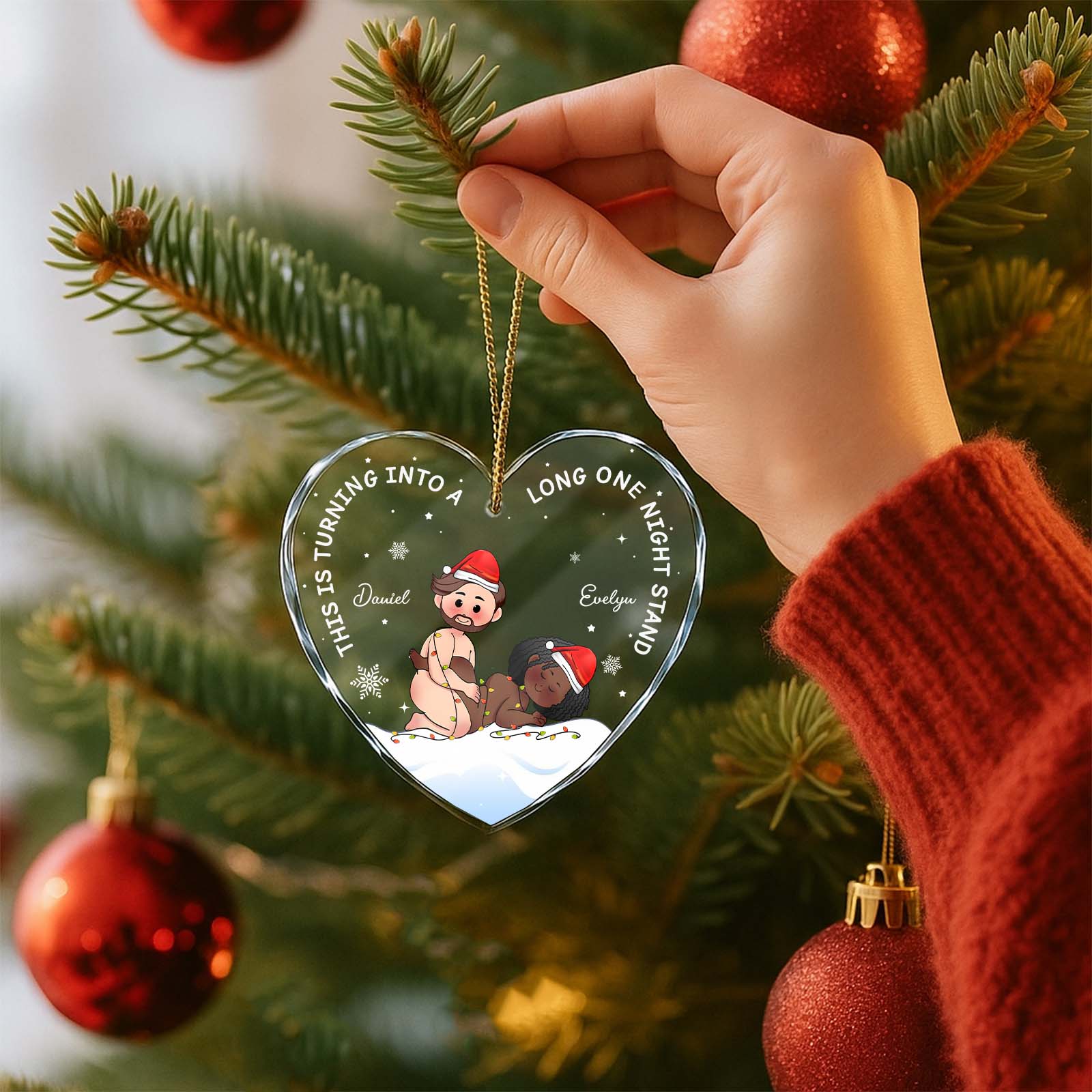 Personalized heart glass ornament featuring a festive design with names for holiday decorations