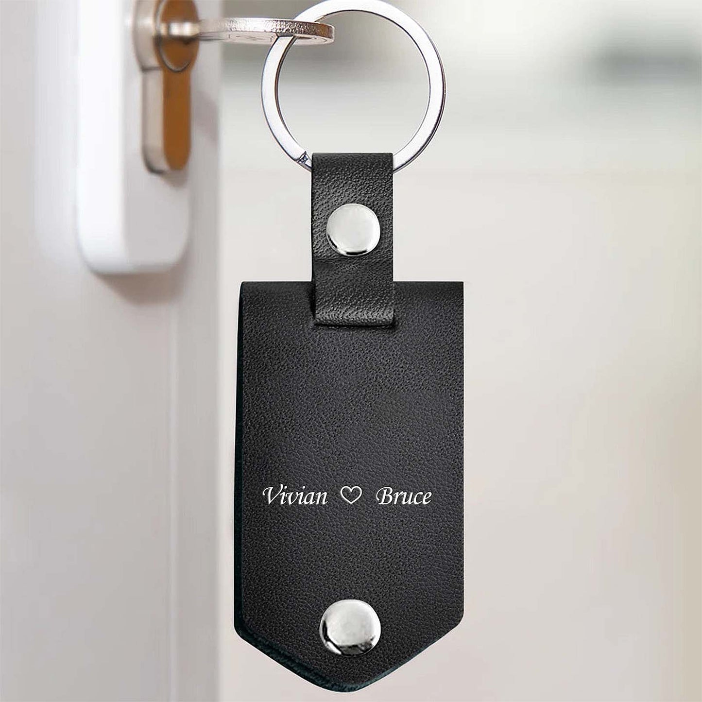 Personalized memorial photo keychain in black leather with engraved names for cherished memories