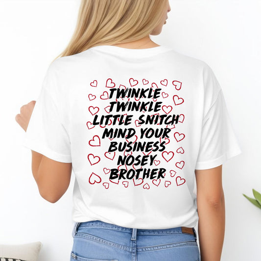 White personalized mind your business t-shirt with black text and red hearts on back worn by woman