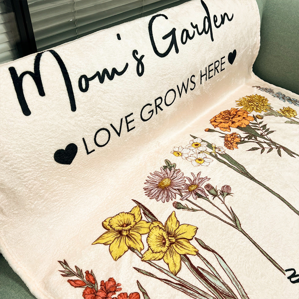 Personalized mom blanket featuring floral designs and the text Mom's Garden Love Grows Here