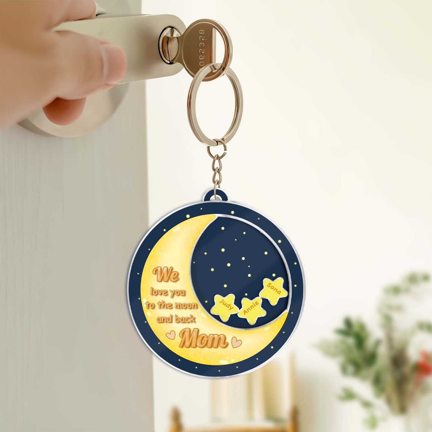 Personalized mom shaking keychain featuring a moon and stars design with heartfelt message