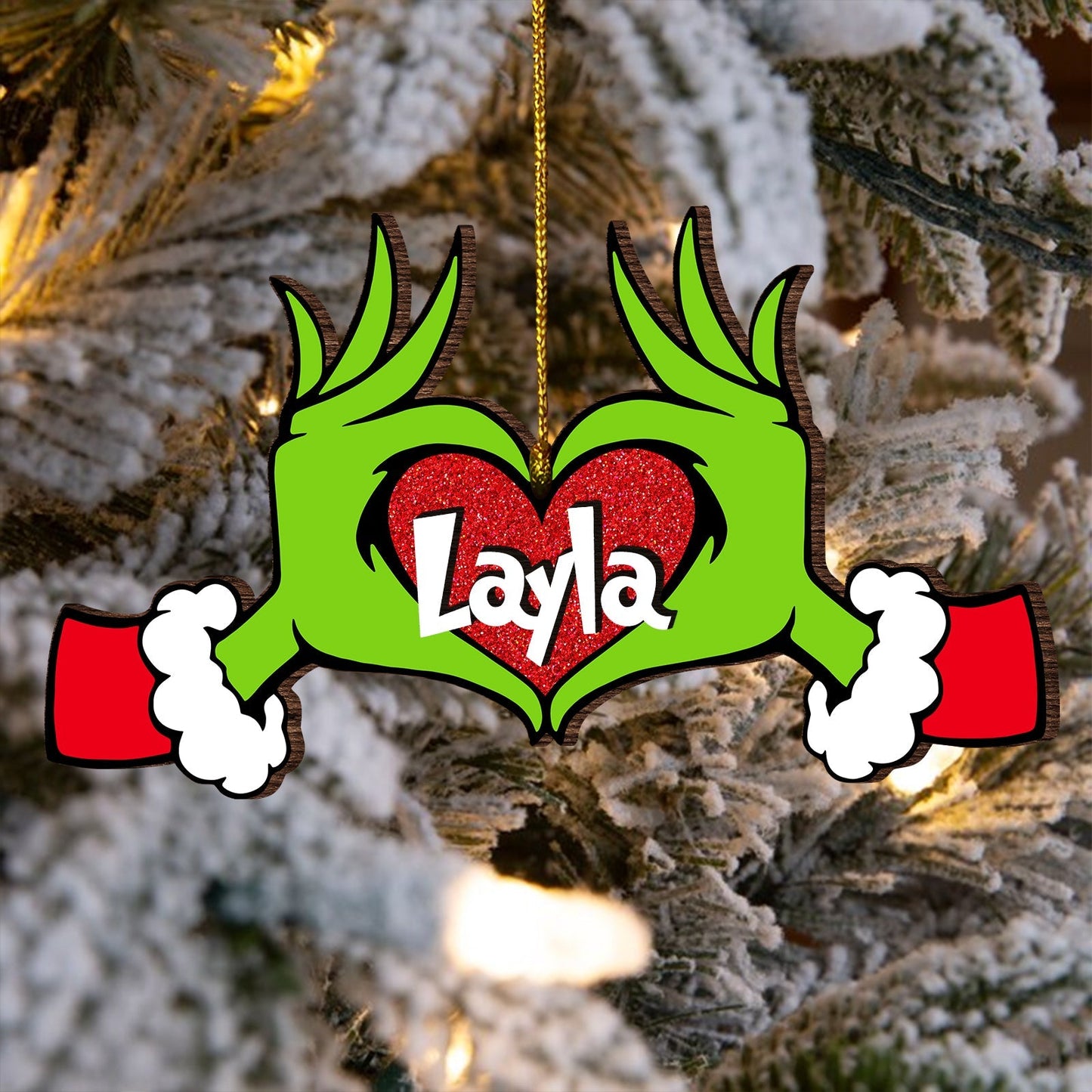 Personalized monster family Christmas ornament with green hands forming heart shape and name Layla
