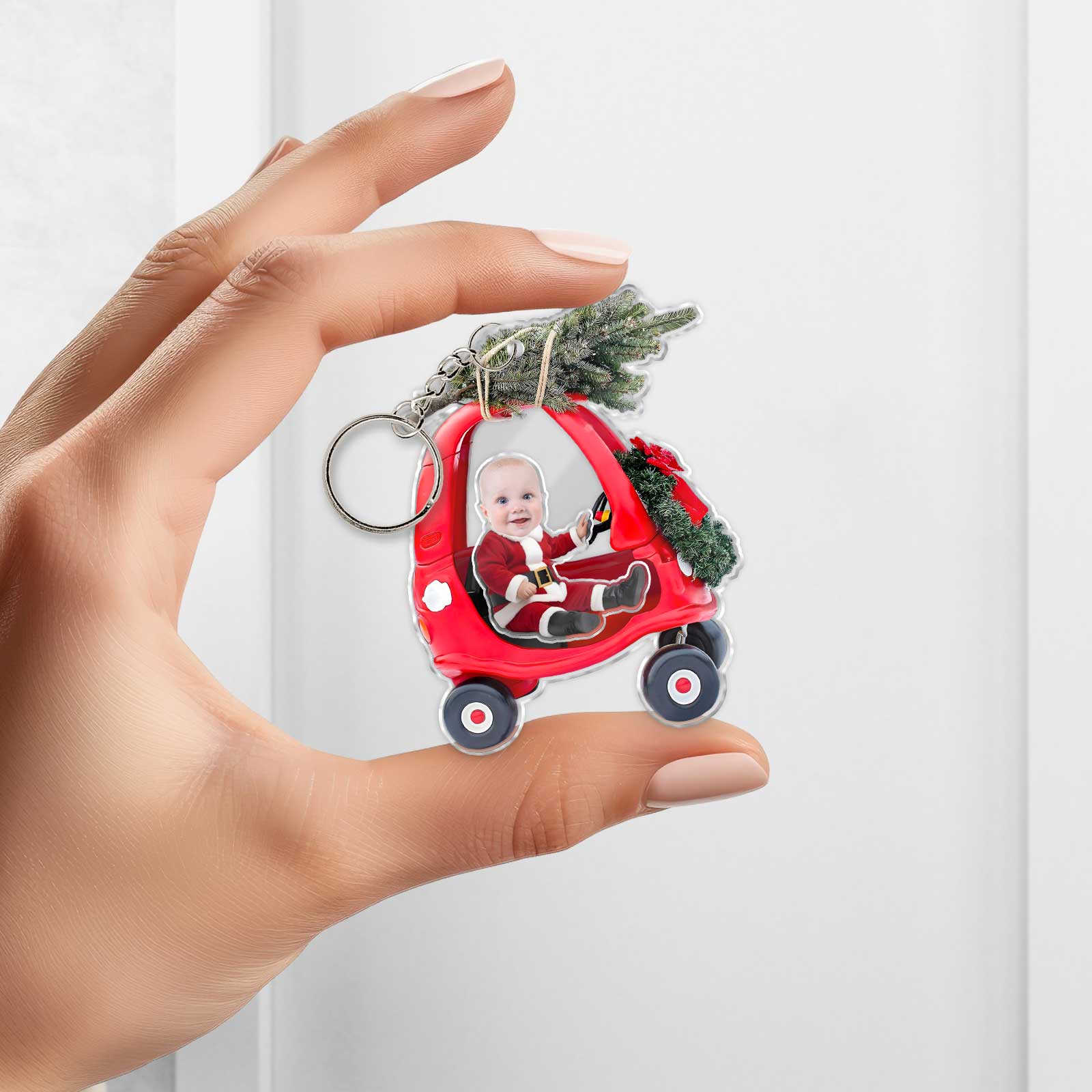 Personalized new parent gift idea featuring a keychain with a baby in a red toy car