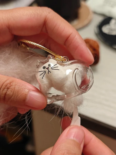 Handcrafted personalized pet keepsake gift featuring a cute glass cat figurine with soft fur detail