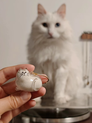 Adorable personalized pet keepsake gift featuring a cute cat figurine with a charming design