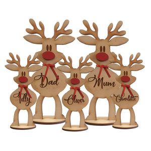 Personalized reindeer family decoration with wooden reindeer figures labeled Dad Mum Tilly Oliver and Charlotte