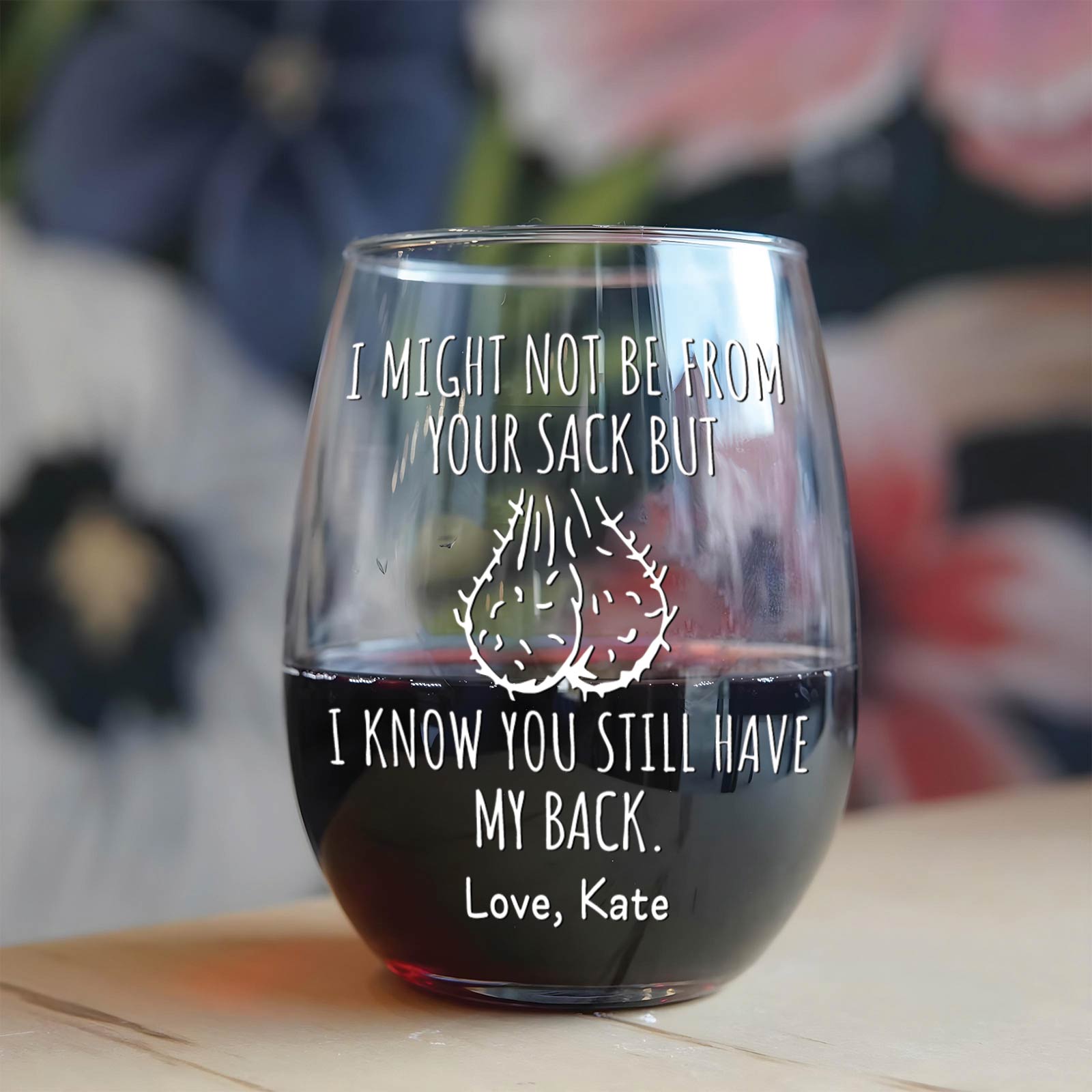 Personalized stepdad wine glass with humorous text and custom name, filled with red wine