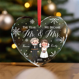 Personalized wedding ornament featuring a couple with names and year in a heart shape