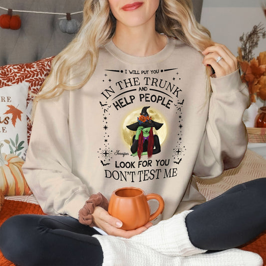 365Gifty personalized witch Halloween sweatshirt with spooky design and text worn by woman holding a pumpkin mug