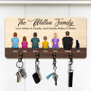 Personalized wooden key hanger featuring a family design with six hooks for keys and accessories