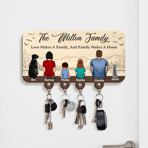 Personalized wooden key holder with family illustration and four key hooks for organized storage