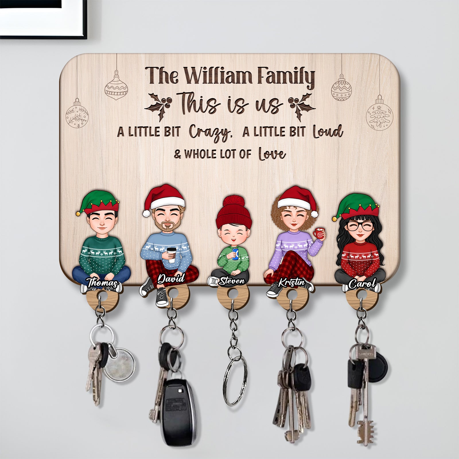 Personalized wooden key holder depicting a family with names and key hooks for easy access