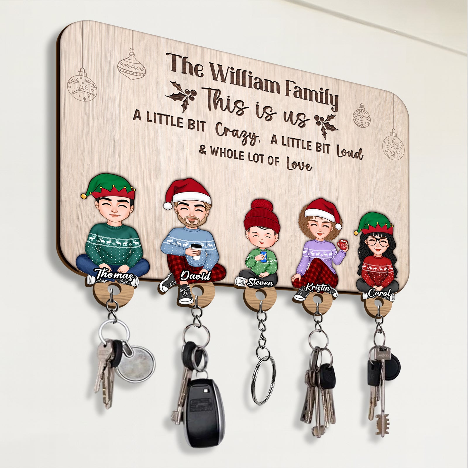 Personalized wooden key holder featuring cartoon family with hooks for keys and keychains