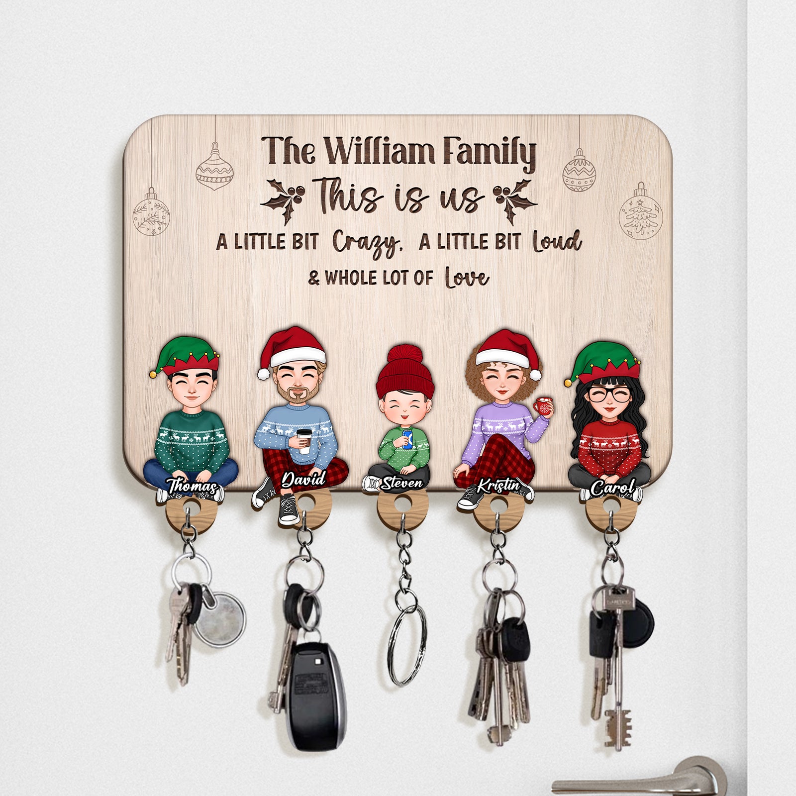 Personalized wooden key holder featuring a family design with five characters and hooks for keys