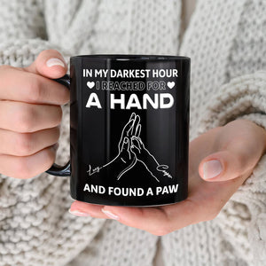 Black personalized pet lover mug with white hand and paw illustration and sentimental quote