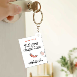 Photo acrylic slider card keychain featuring a playful design with an instruction to pull