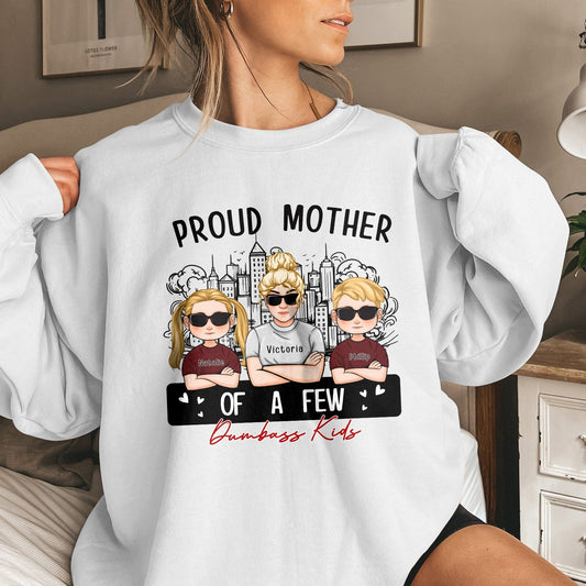 White sweatshirt with cartoon design and text proud mom of a few dumbass kids by 365Gifty