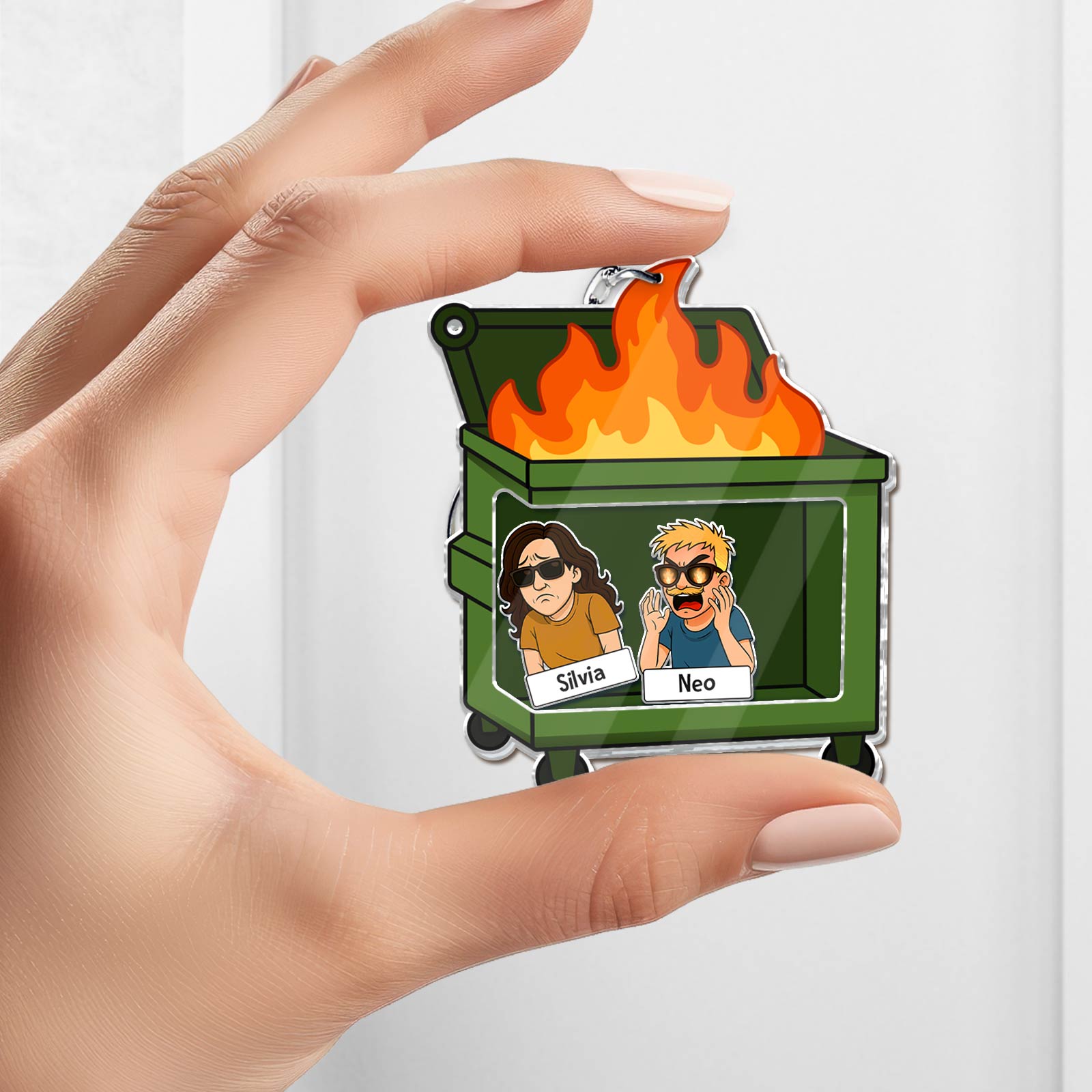 Shaking Keychain For Coworker featuring a green dumpster with flames and cartoon coworker characters