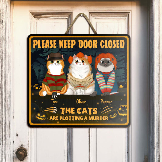 Halloween personalized cat door sign featuring three cats in horror costumes with custom names hanging on white door