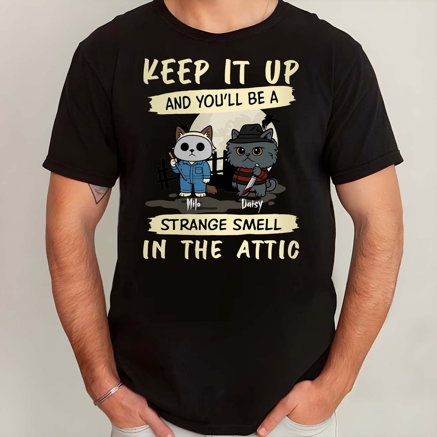 Black bat shaped wooden sign reading UNWELCOME hanging on a fence in yard personalized Halloween cat shirt