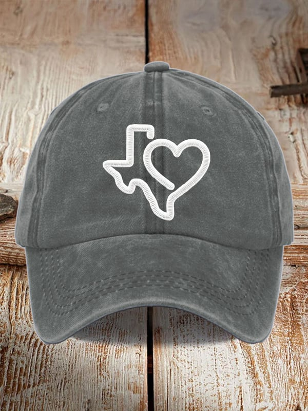 Gray Texas strong baseball cap with white outline of Texas and heart design