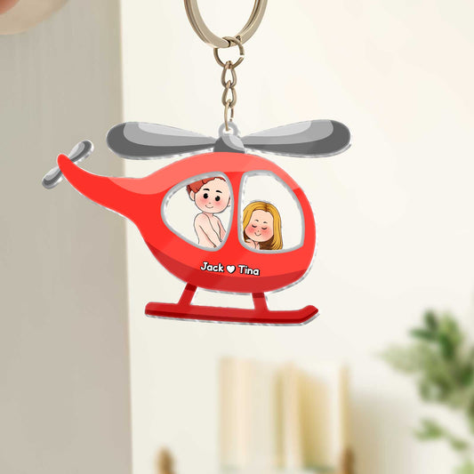 Personalized unique shaking keychain for couples featuring a red helicopter design with cartoon characters