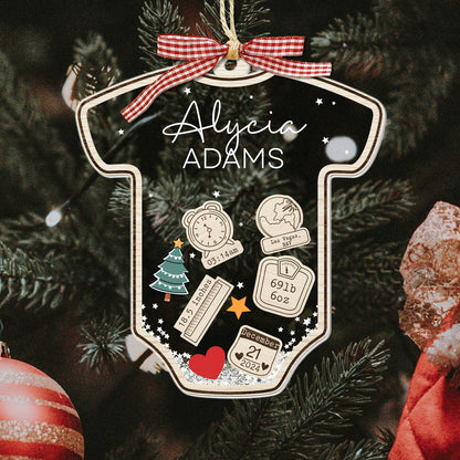 Personalized baby's first Christmas ornament shaped like a onesie with name Alycia Adams and birth details