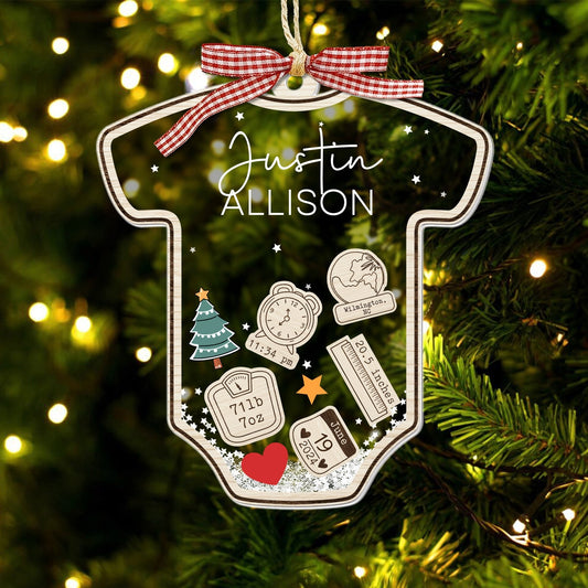 Personalized baby's first Christmas ornament shaped like a onesie with name Justin Allison and detailed birth info