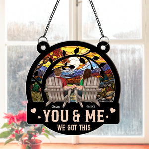 Personalized couple suncatcher ornament featuring a couple holding hands with a colorful sunset background