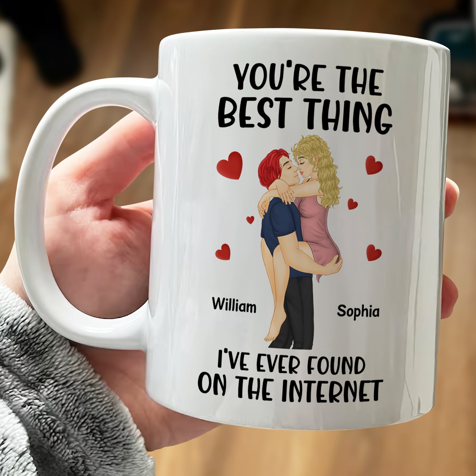 White mug with illustration of couple hugging and text you're the best thing I've ever found on the internet mug